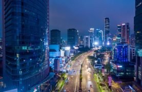 aerial-view-of-modern-city-center-with-skyscrapers-downtown-jakarta-at-night.jpg
